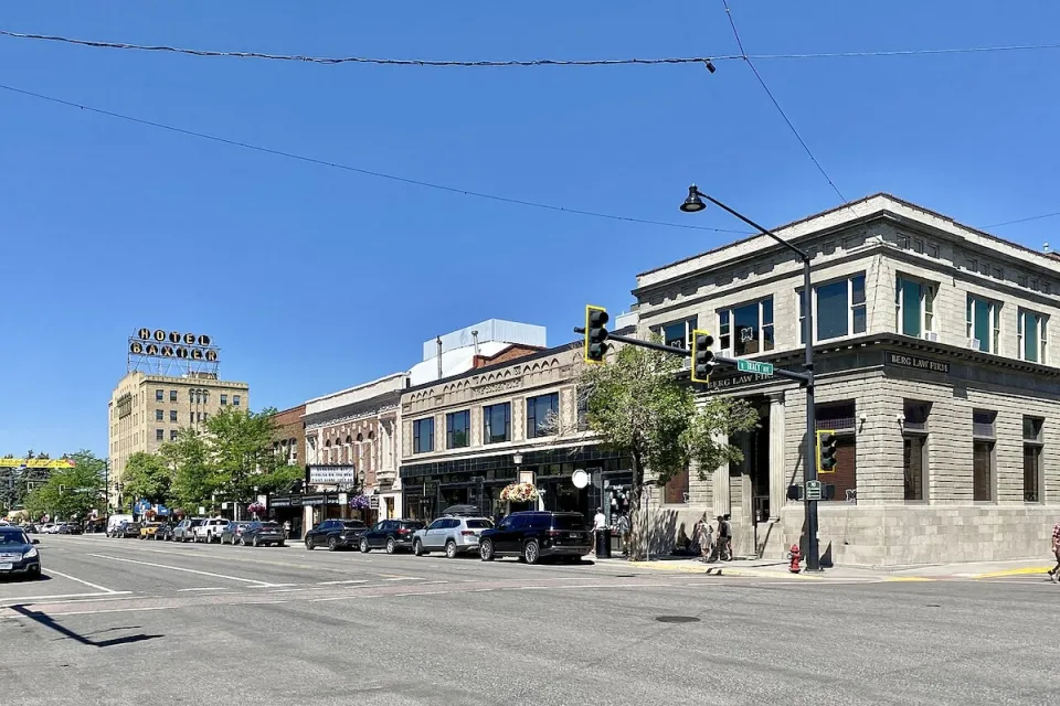 Main Street with two-story brick buildings in Bozeman, Montana.